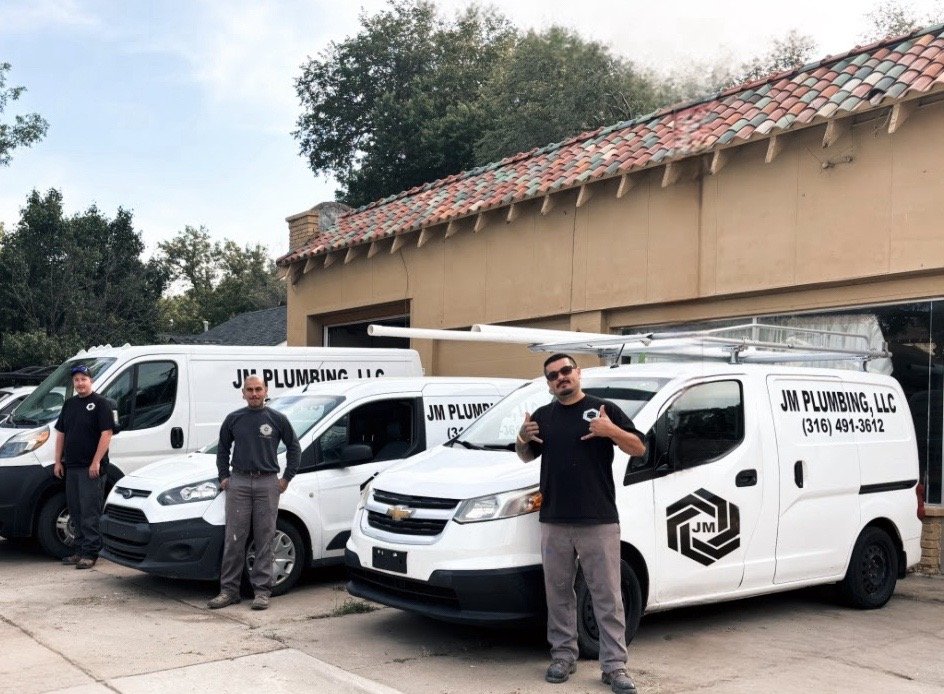 Owners by the JM Plumbing van